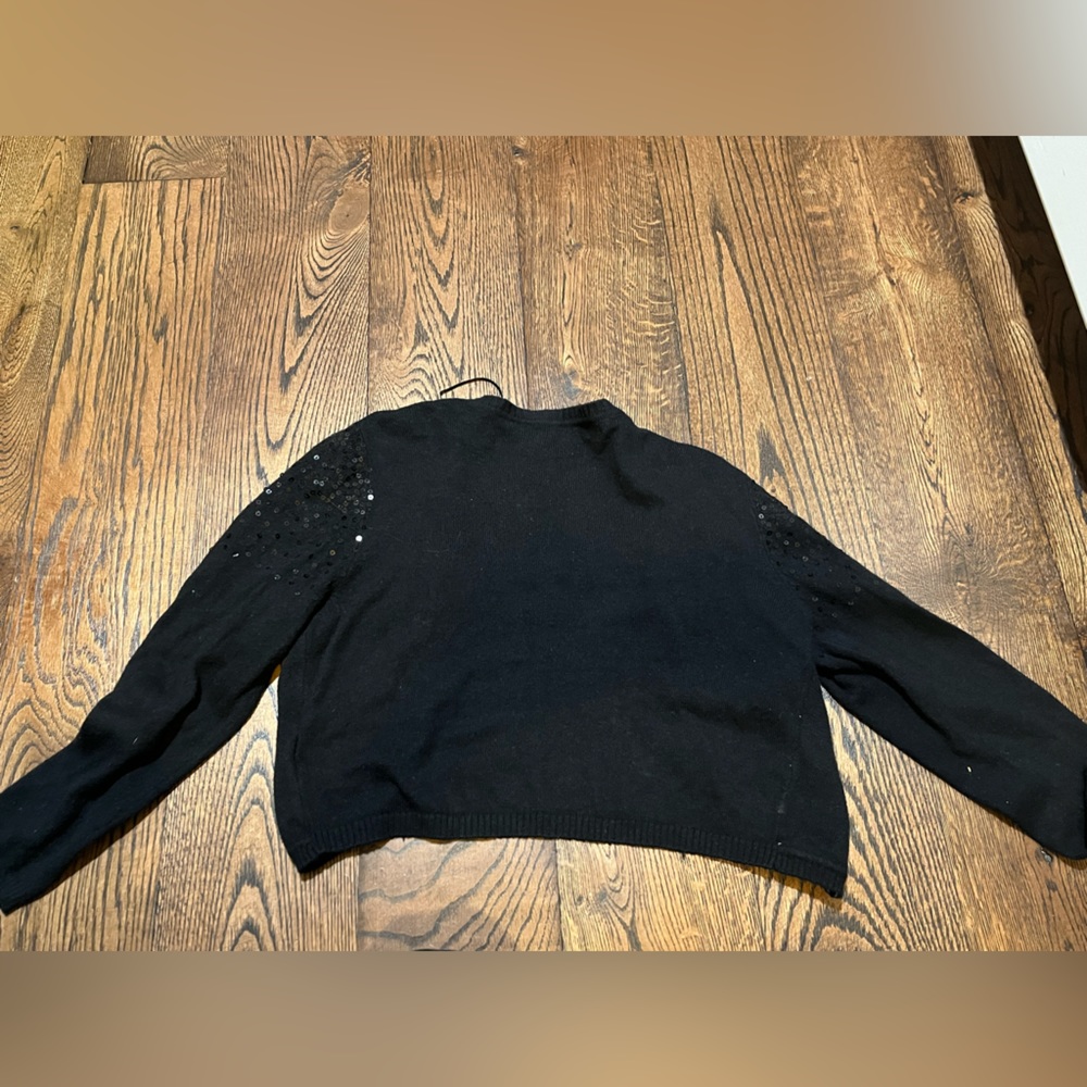 Is a black sparkly dress jacket